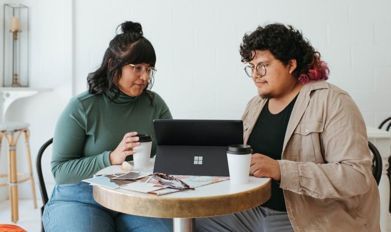 Two people sharing digital learning